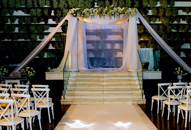 If the chuppah is build on a platform, care must be taken that the steps leading up to it are not too steep, nor too narrow for the bride in her wedding dress. It must also be solid enough to support the groom when his foot breaks the glass at the end of the ceremony. The platform must have enough room for the bride and groom, both sets of parents and the rabbi. There should also be space for a table and possibly a microphone on a stand.