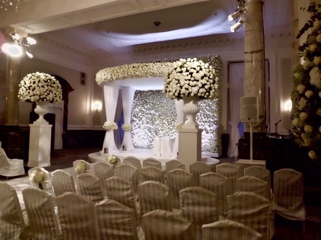 It is better not to have too much foliage. Less can be more. The guests have come to see the couple, not a flower show. Some guests may be sensitive to pollen due to hay-fever, or suffer from food, or other allergies.