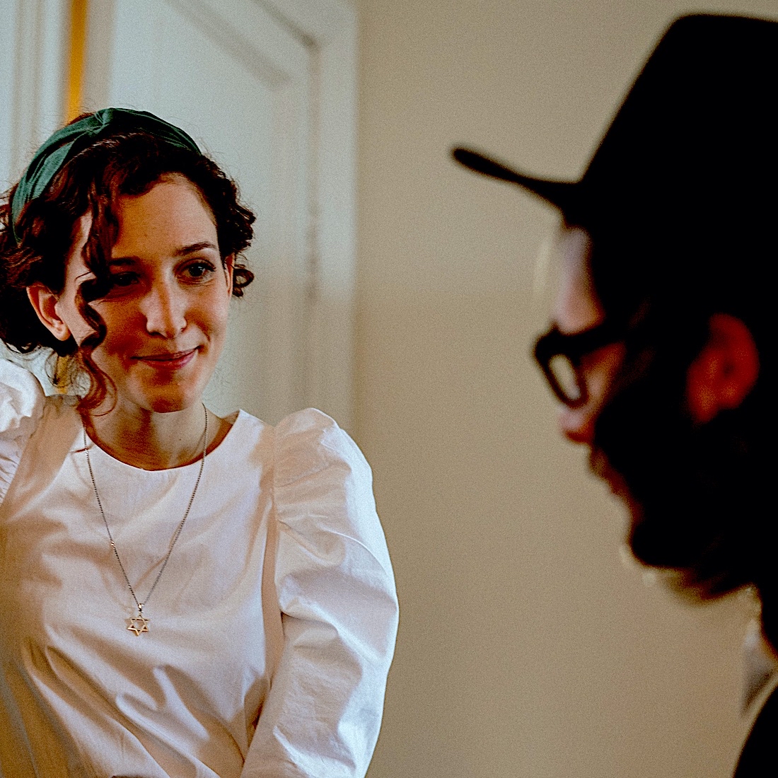 A couple relaxing after their jewish wedding led a rabbi in Europe.